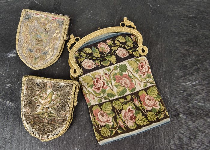 Three embroidered purses