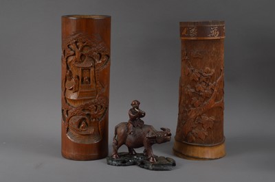 Lot 503 - A far eastern carved man and cow