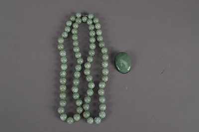 Lot 513 - A modern Chinese jade bead necklace