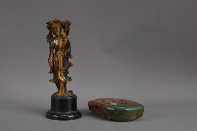 Lot 519 - A Chinese carved tiger eye figure of Guanyin