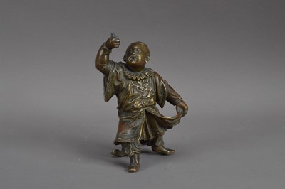 Lot 525 - A Chinese bronze of a dancing child