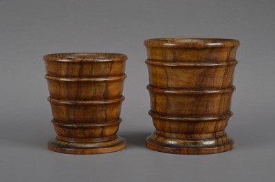 Lot 535 - Two early 20th century olive wood turned beakers