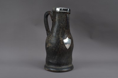 Lot 538 - A 19th century leather and silver-plated jug