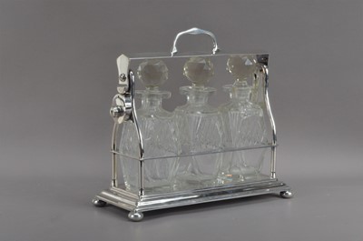 Lot 573 - An art deco silver plated tantalus