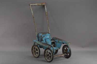 Lot 591 - A first half 20th century metal painted dolls push chair