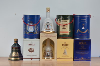 Lot 651 - A collection of Bells commemorative decanters