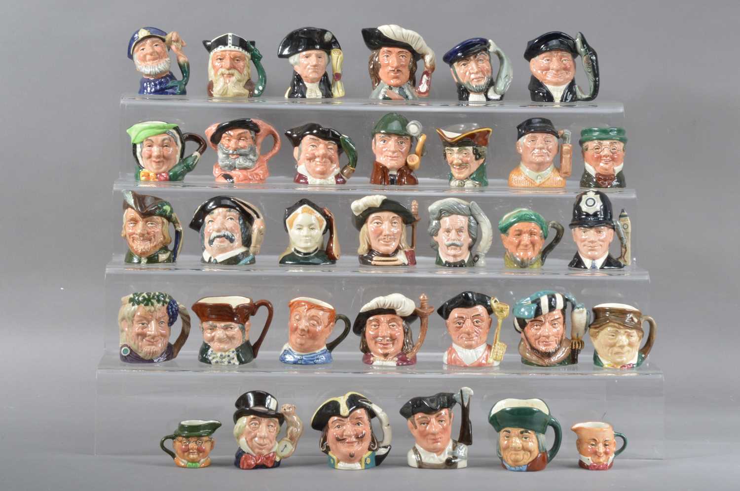 Lot 95 - A large collection of miniature Royal Doulton character jugs