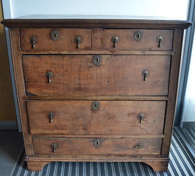 Lot 835 - A large 17th century and later oak chest if drawers, two short drawers over three long, with later tear-drop handles, on ogee feet, AF, 106cm H x 108cm W