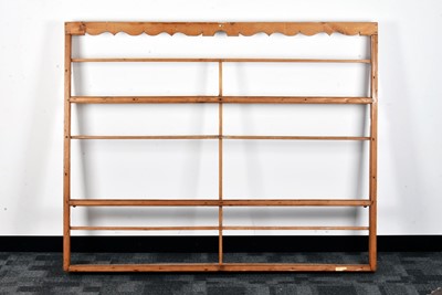 Lot 837 - A 19th century pine wall mounted plate rack