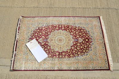 Lot 851 - An Iranian Qum silk rug