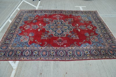 Lot 860 - A damaged large woollen rug