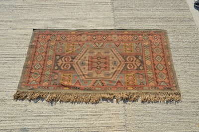 Lot 867 - A middle Eastern flat weave rug