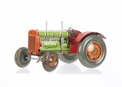 Lot 680 - A Mettoy tinplate clockwork Tractor