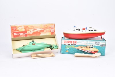 Lot 781 - Sutcliffe unused tinplate clockwork Pilot boat and Submarine