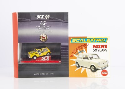 Lot 210 - Modern SCX Mini 50th Anniversary Slot Car & Book