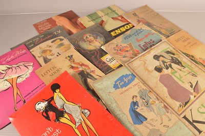 Lot 68 - A good collection of vintage fashion advertising signs