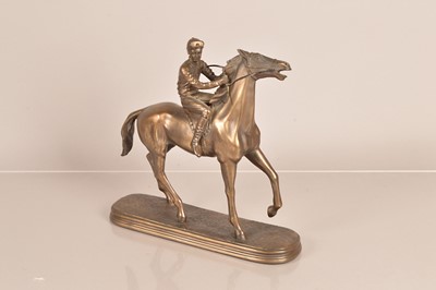 Lot 173 - A resin figure of a Jockey and racehorse