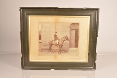 Lot 203 - A black and white photograph of a huntsman on horse back