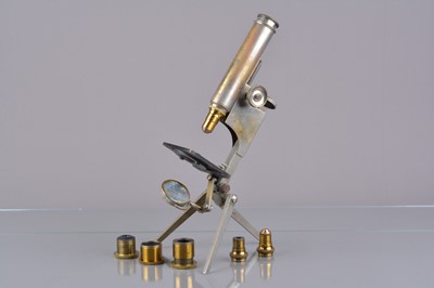 Lot 16 - An early 20th Century nickel-plate brass R & J Beck Folding Portable Compound Monocular Microscope