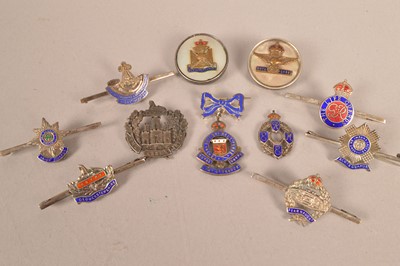 Lot 576 - A group of silver and enamel Regimental sweetheart brooches