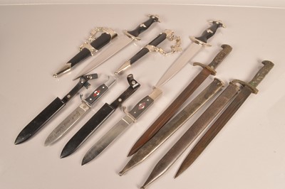 Lot 735 - A group of Reproduction German daggers and knives