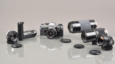 Lot 246 - An Olympus OM-10 SLR Camera Outfit