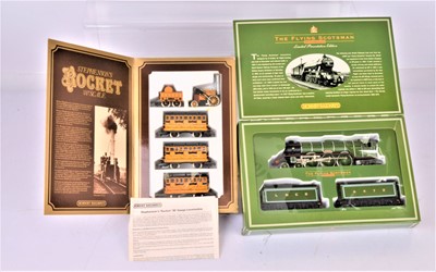 Lot 389 - Hornby 00 Gauge Flying Scotsman Double Tender pack and Stephenson's Rocket Set (2)