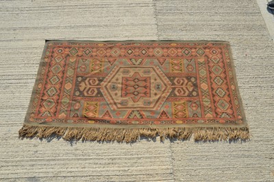 Lot 4 - A middle Eastern flat weave rug
