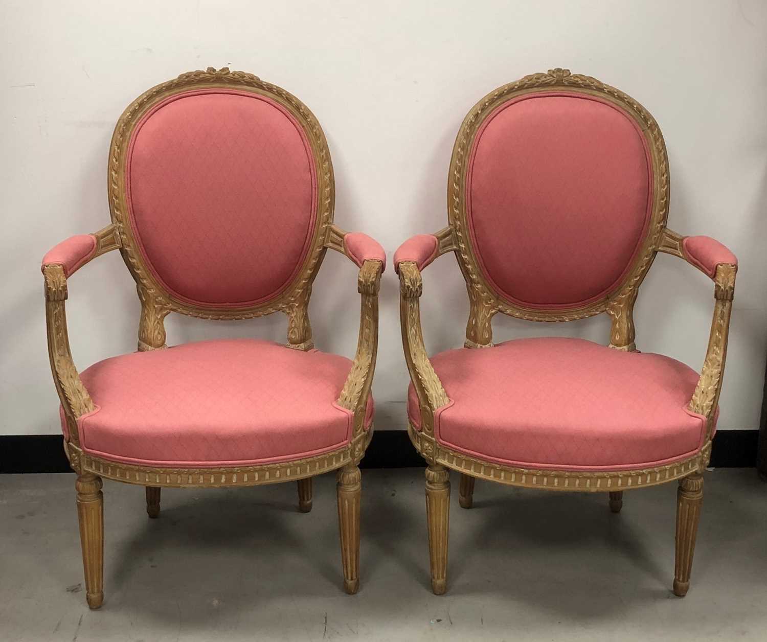 Lot 24 - A pair of French Louis XV style armchairs