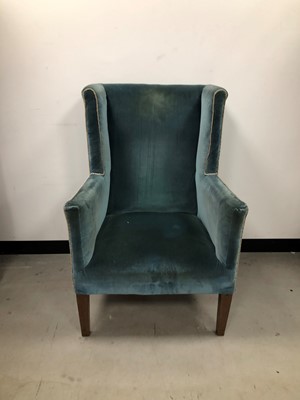 Lot 35 - A velvet upholstered wingback armchair