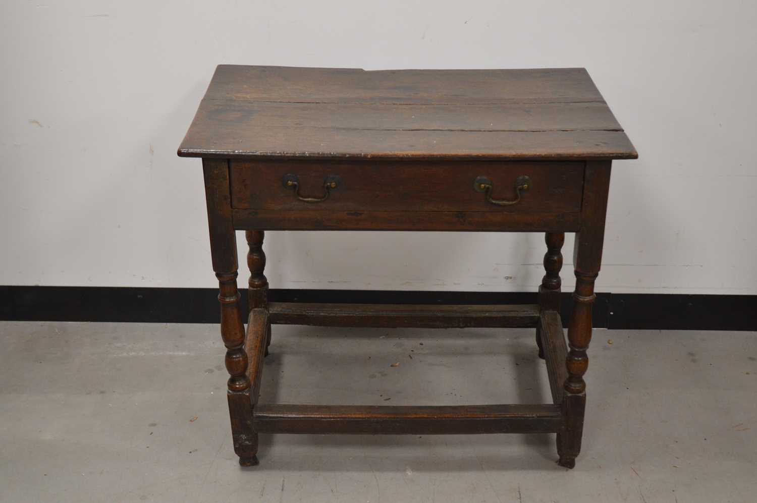 Lot 71 - An 18th century and later oak table