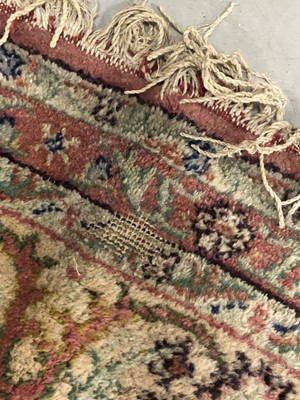 Lot 75 - A large middle eastern woollen rug