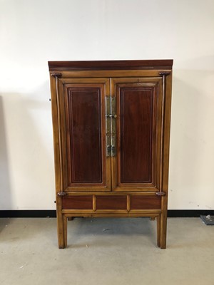 Lot 97 - A modern Chinese hardwood wardrobe