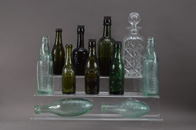 Lot 186 - A collection of Victorian and later coloured glass bottles