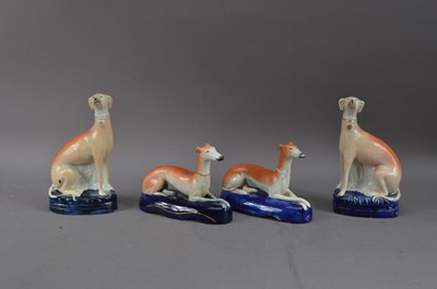 Lot 222 - Four 19th century Staffordshire Greyhound dog figurines