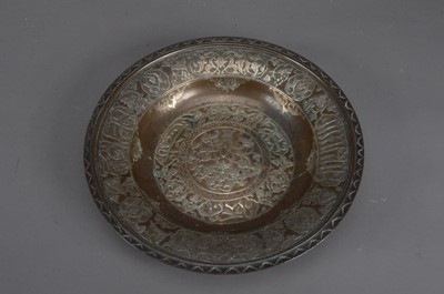 Lot 255 - A copper and silvered Islamic bowl