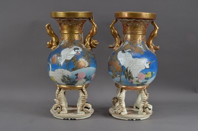 Lot 260 - A pair of Chinese damaged twin handled vases/covers