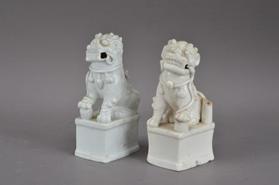 Lot 262 - A pair of 19th century Chinese blanc-de-chine ceramic temple dogs