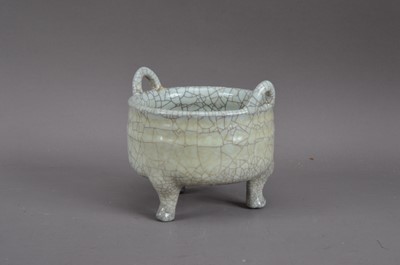 Lot 266 - A Chinese crackled glazed twin-handled footed pot