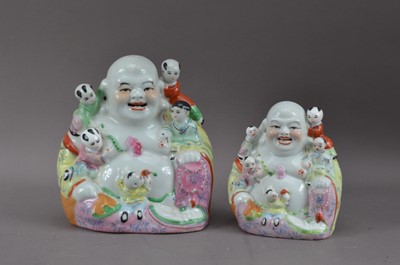 Lot 288 - Two Chinese ceramic Buddha's with children