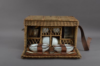 Lot 302 - An early to mid 20th century wicker picnic basket