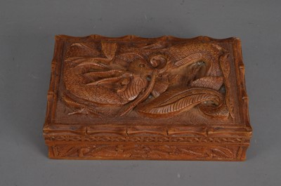 Lot 318 - A carved wooden box