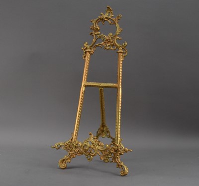 Lot 393 - A decorative gilt metal picture stand