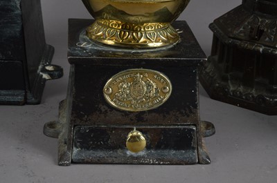 Lot 402 - A collection of 19th century and later cast metal coffee grinders