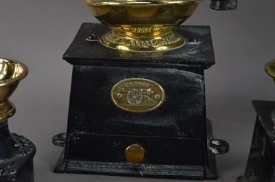 Lot 402 - A collection of 19th century and later cast metal coffee grinders