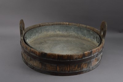 Lot 433 - A wooden and brass bound wide bucket