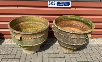 Lot 591 - A large pair of weathered terracotta garden planting vases
