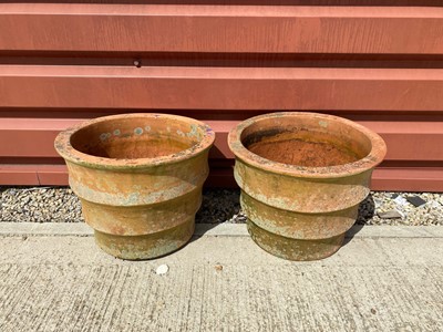 Lot 593 - A pair of weathered terracotta garden plant pots