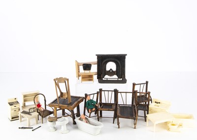 Lot 250 - A late 19th century dolls' house or sample cast-iron fireplace