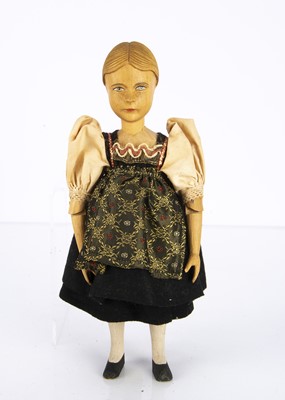 Lot 251 - A Swiss carved wooden girl doll